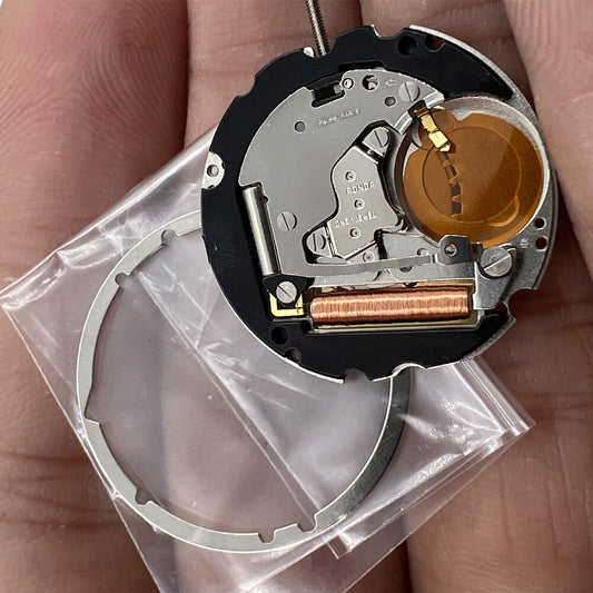 Close-up of Ronda 704 quartz watch movement with date display at 6 o'clock, Swiss precision part.