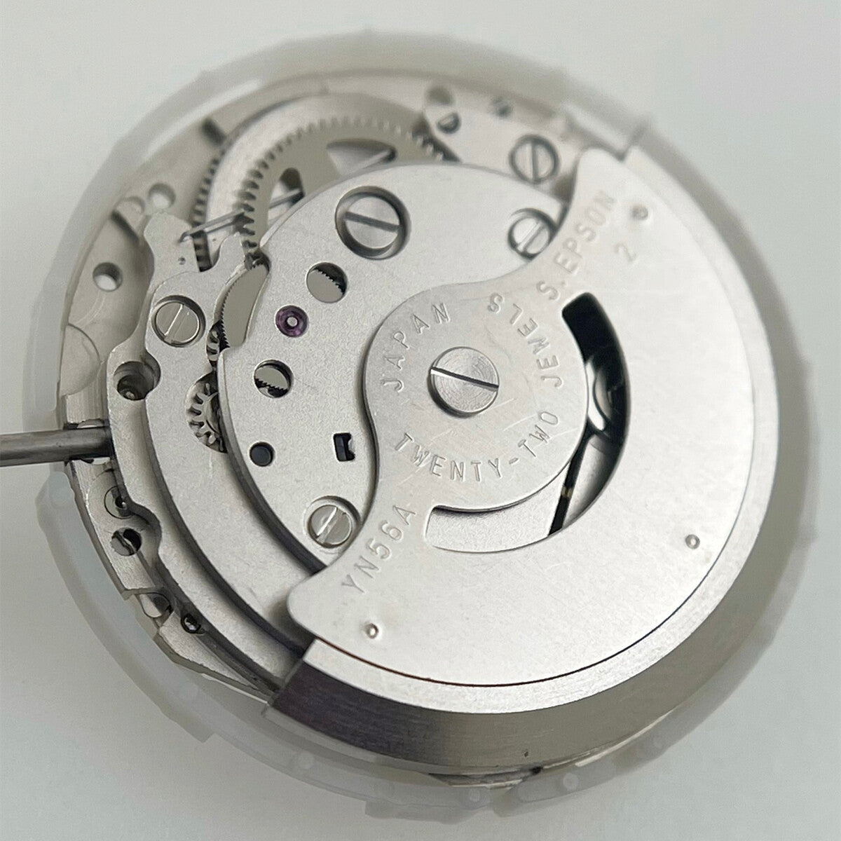 Epson YN56 mechanical watch movement displaying day and date, precision Japan brand quality.