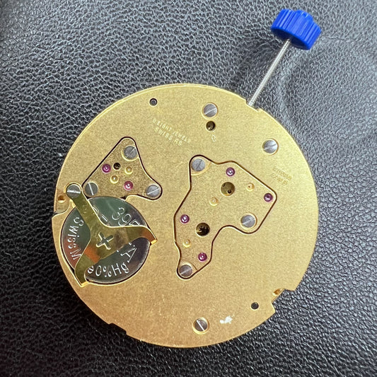 Swiss Ronda 4210B golden quartz watch movement, precise Swiss craftsmanship for luxury timepieces.