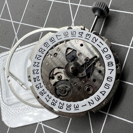 Miyota/Citizen 8200/8215 watch movement with single calendar date display at 6 o?clock position.