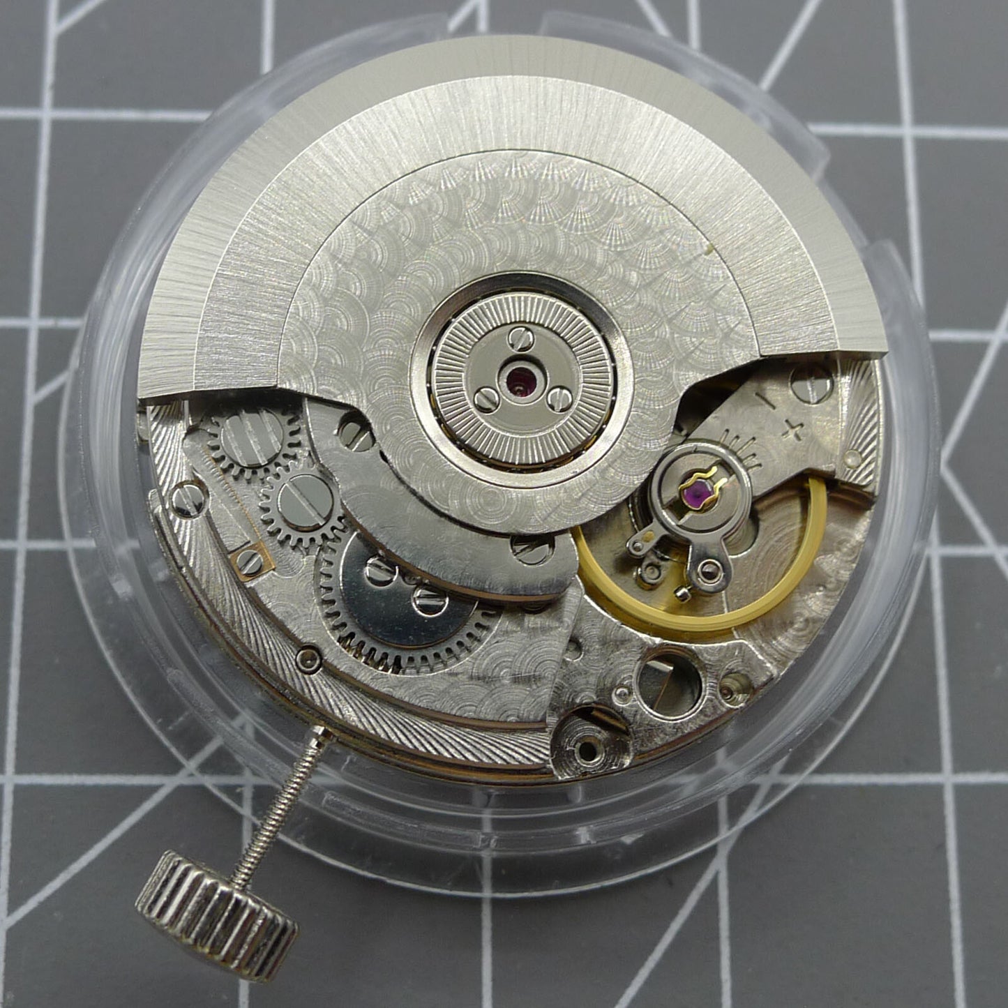 Black Seagull ST2555 automatic watch movement showing second hand at 9H, perlage finish, and big date display.