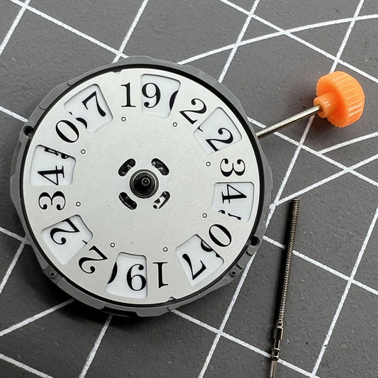 Miyota 1M52 quartz watch movement with date at 12 and three hands, precise timekeeping.