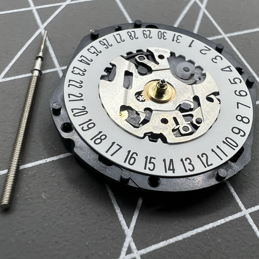 Hattori Epson TMI VX12 quartz watch movement with date at 3/6, Japan made precision parts