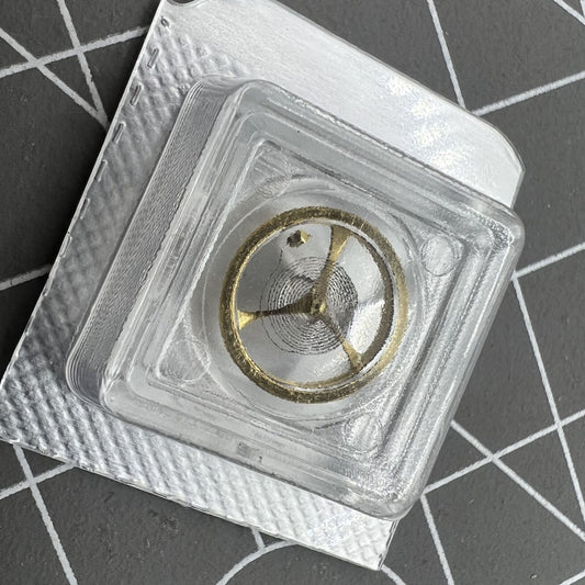 Golden balance wheel with hairspring for Orient 46941 46943 watch movement, precision timing component by Orient.