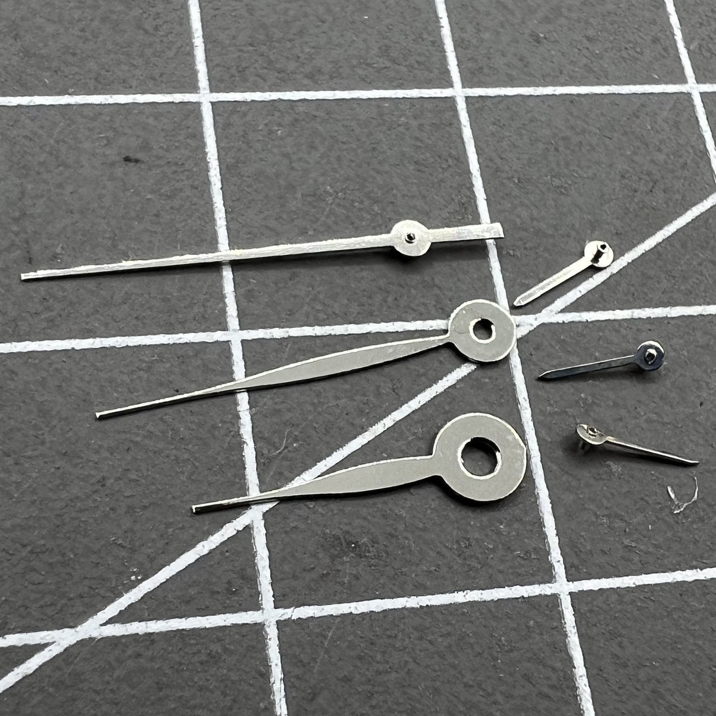 14mm silver long arrow watch hands for Miyota 0S11 movement, sleek design, no lume.