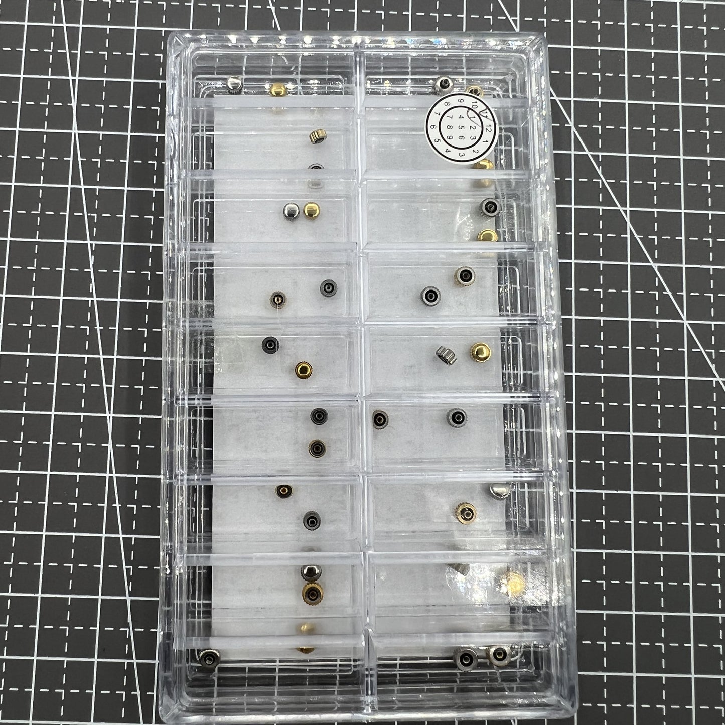 Set of 36 stainless steel watch crowns by Japan Style, ideal for precise watch repairs and replacements.