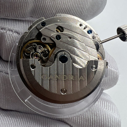 Seagull T17 watch movement close-up showcasing ultra-thin automatic mechanical design with kinetic energy display.