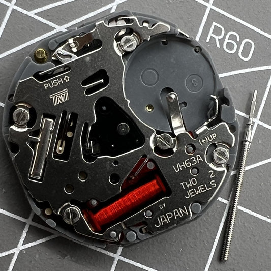 Hattori Epson VH63A quartz watch movement from Japan, precise repair accessory for accurate timekeeping.
