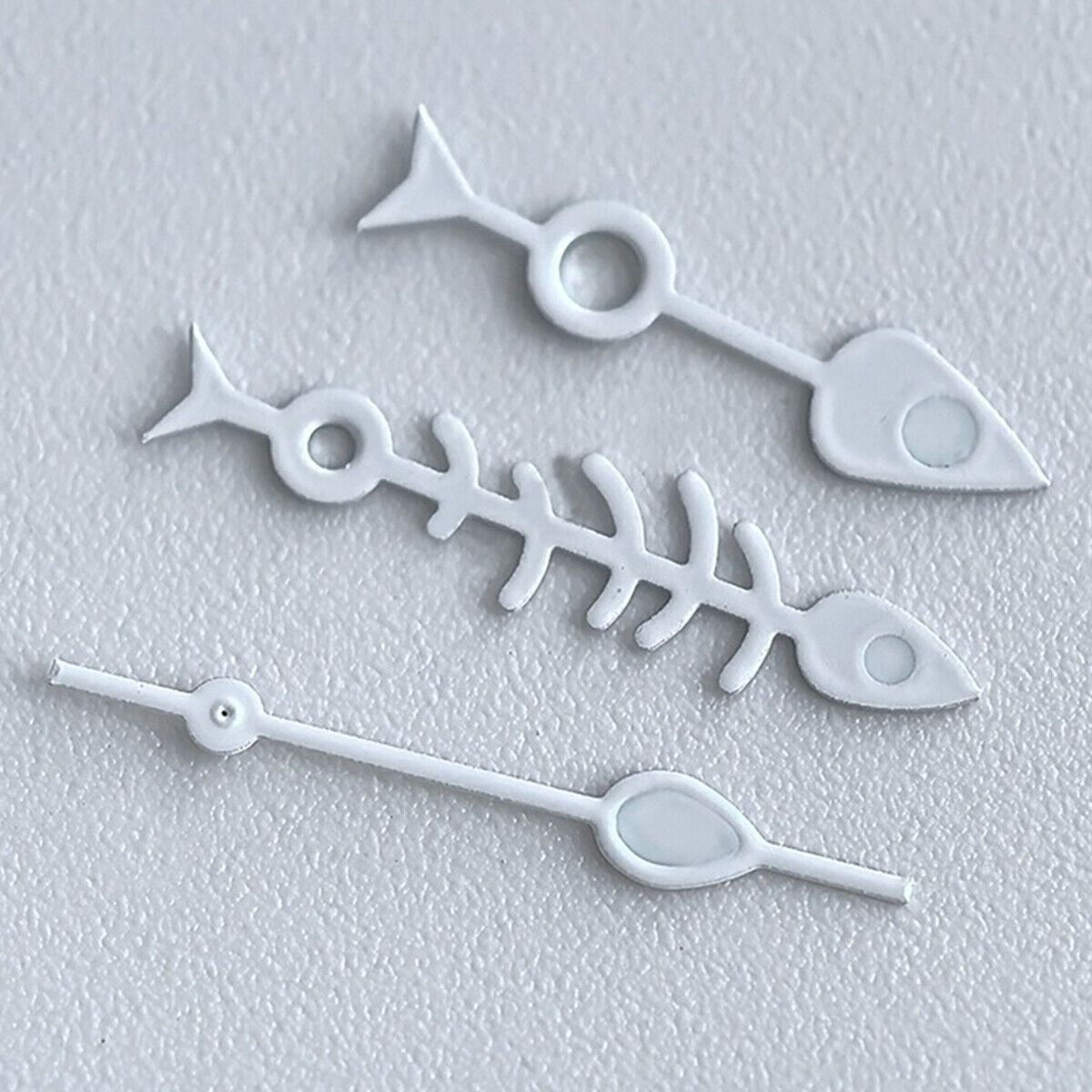 Matted black fish bone watch hands with white trim and green lume, NH35 NH36 compatible.