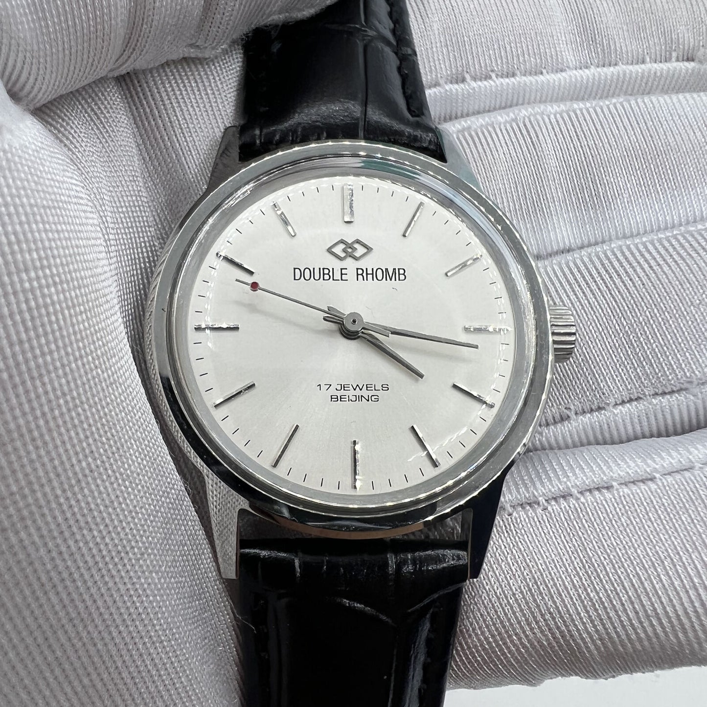 Beijing 36mm Double Rhomb manual watch with silver case and silver nail strap, classic style for elegant wear.