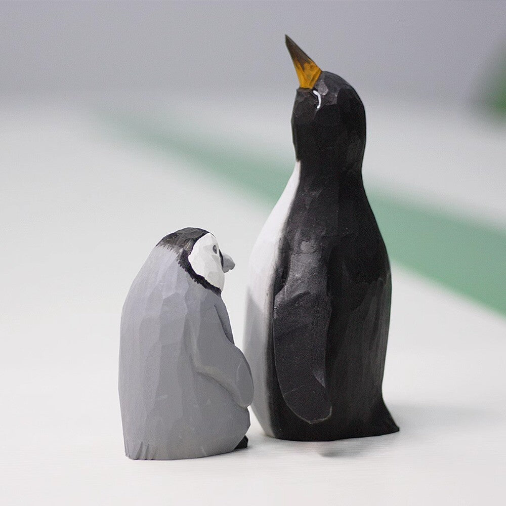 Handmade Emperor Penguin mother and baby wooden figurine, elegant watch accessory decor.