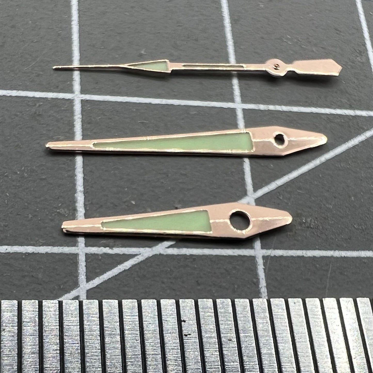 Rose Golden 14mm arrow-shaped luminous watch hands for ISA 2331, enhancing green visibility and precision.