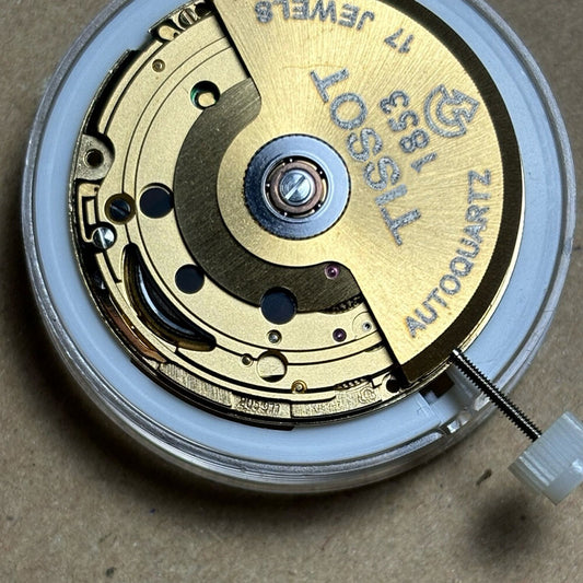 Swiss Made ETA205.911 golden watch movement with artificial kinetic energy for precision timekeeping.