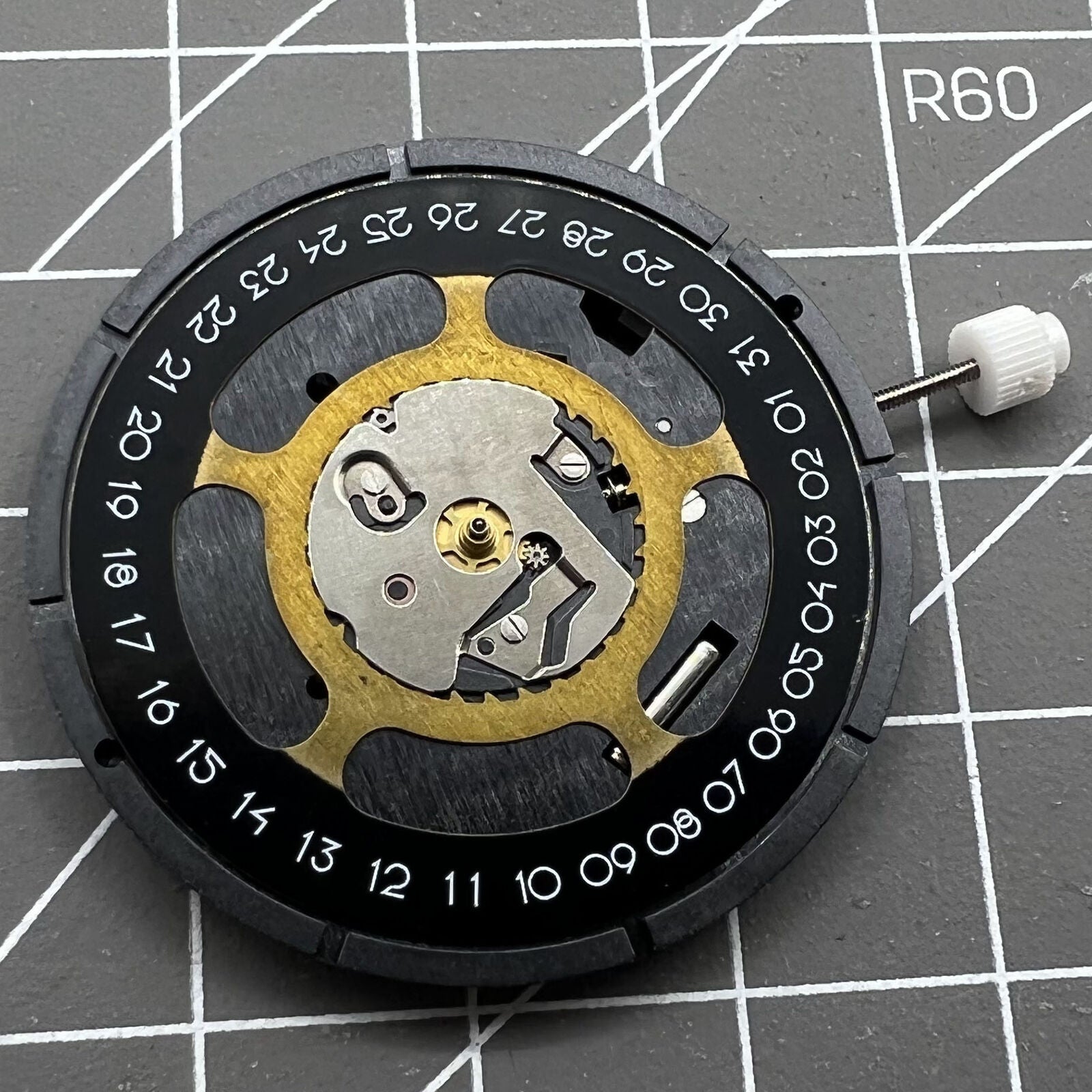 Black dial quartz watch movement ISA 2334/1035 by ISA for precise timekeeping in watch accessories.
