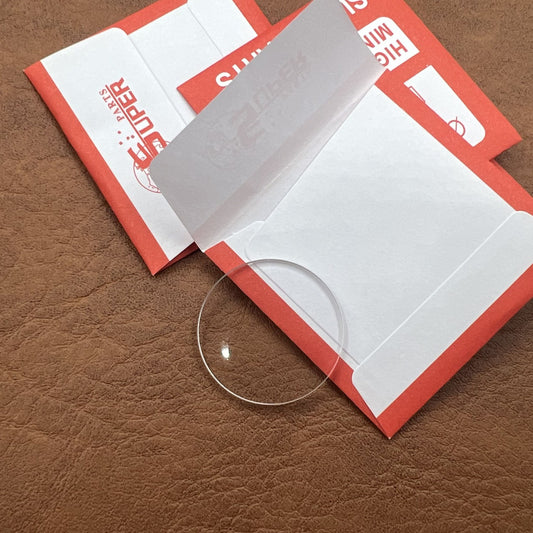 Set of 32 flat round watch glass crystals 24.9-37.6mm, 2.0mm thick, ideal for watch repair and replacement.