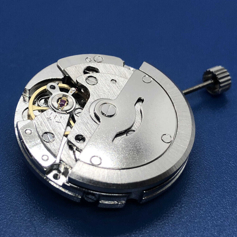 Tian Jing DG2813 automatic watch with silver dial and day-date display, featuring precise mechanical movement.