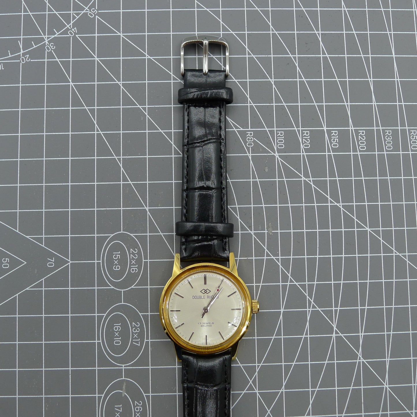 Beijing Double Rhomb mechanical watch with golden case, silver hour markers, showcasing elegant design by Beijing.
