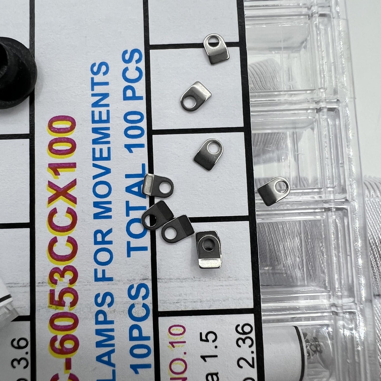 Precision fit casing clamps for watch movements, 10 sizes, 100pcs box, ideal for watch repair.