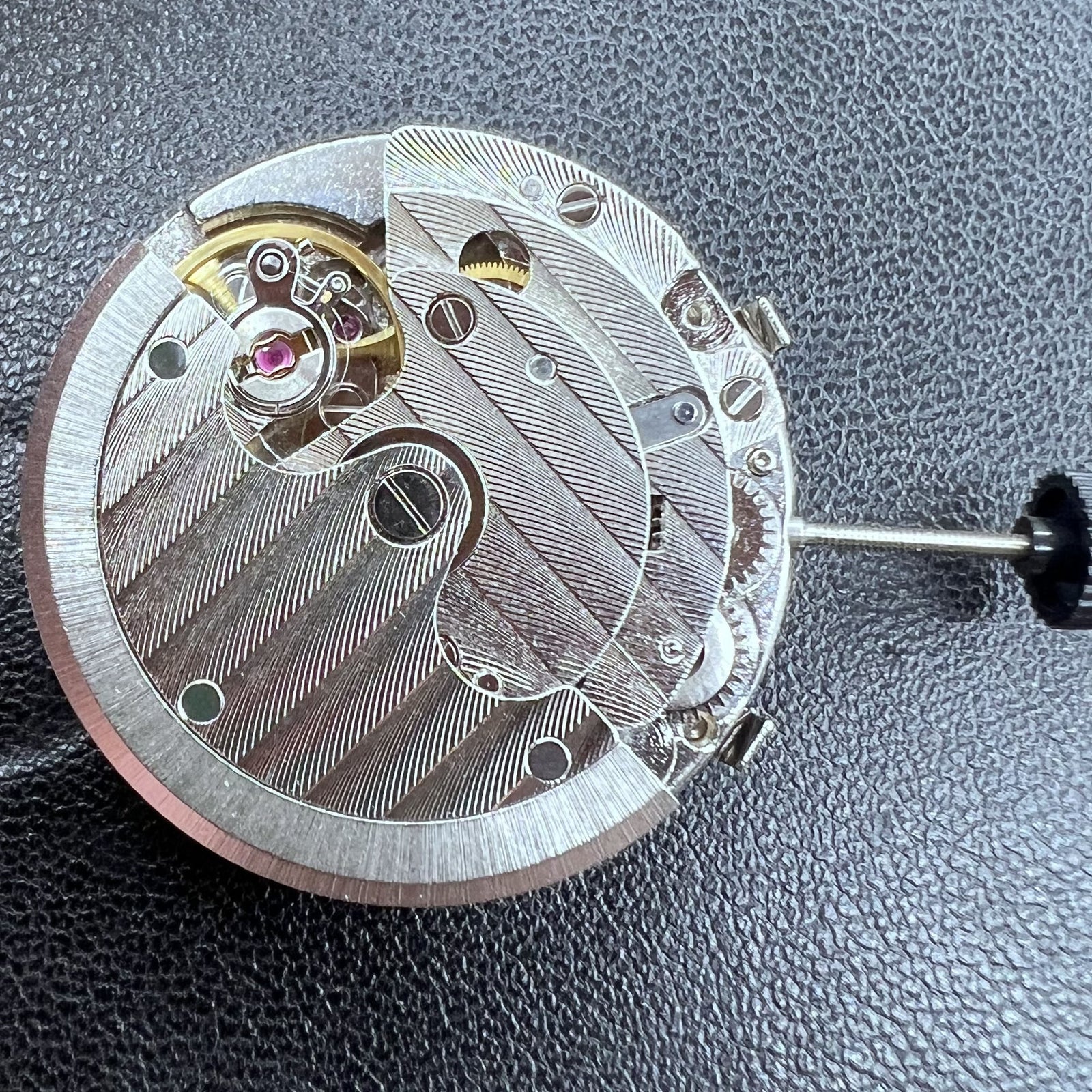 Tianjin T16 watch showcasing automatic mechanical movement with small seconds at 2, 6, and 10 o'clock positions.
