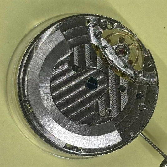 China-made hollow automatic mechanical watch part with moon phase at 12 for precise timekeeping.