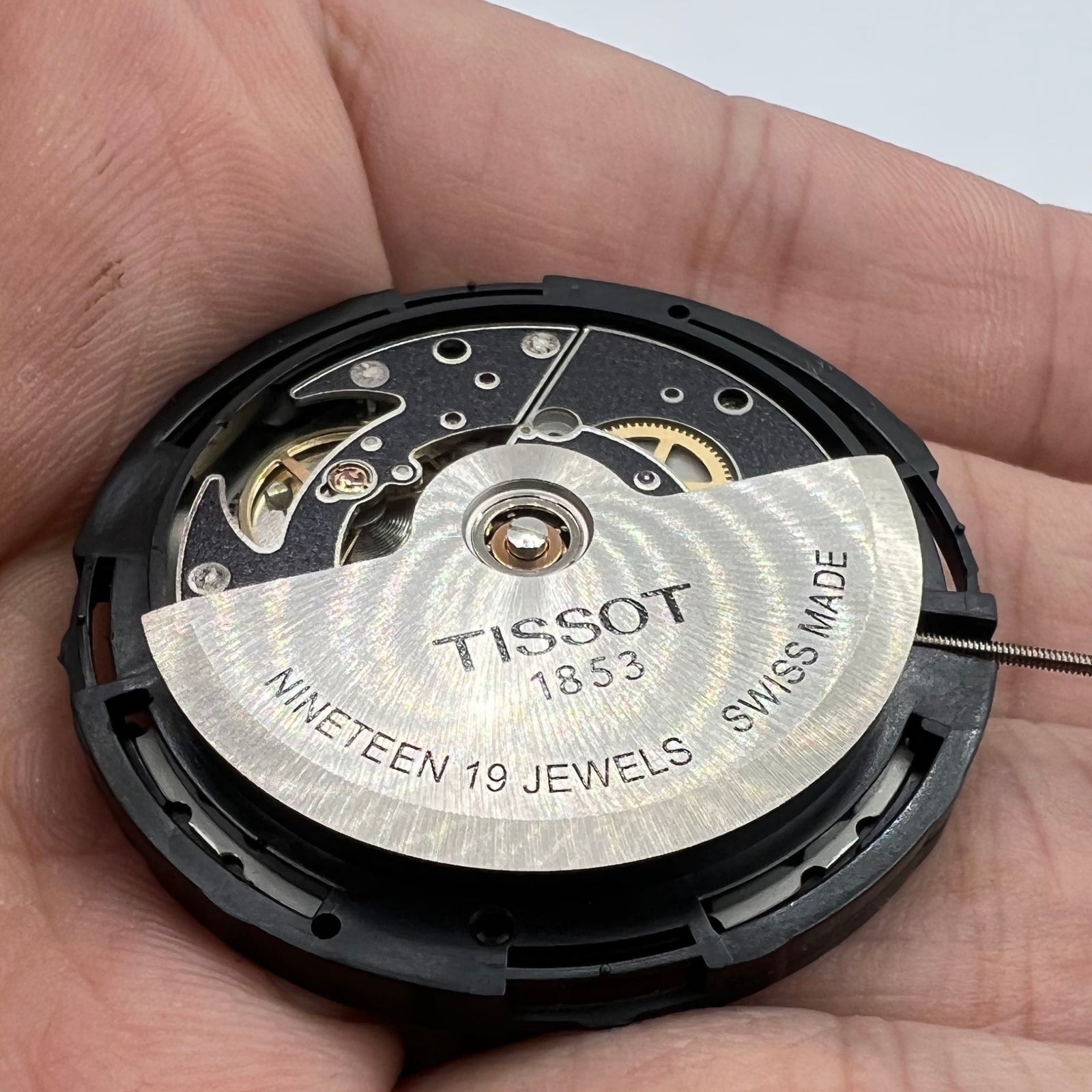 ETA C15.111 chronograph movement by 1853 with white dial, Swiss precision watch accessory.