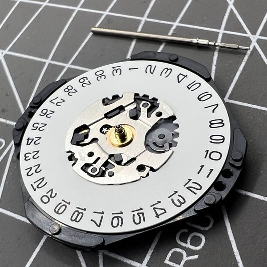 Hattori Epson TMI VX32 quartz watch movement with date at 3, Japan made precision components.