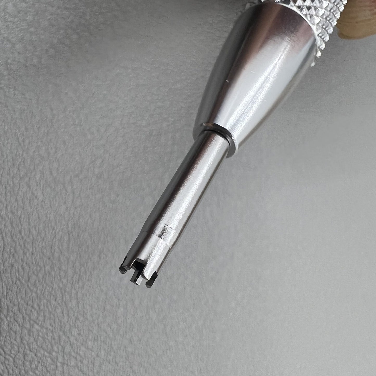 Prong spokes watch screwdriver, ideal for precise Richard Mille screw removal and case adjustments.