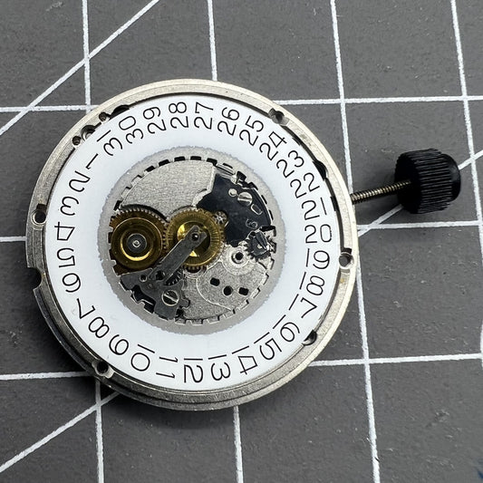 ETA 555.415 quartz watch movement with 3 hands and date at 3, original old stock component.