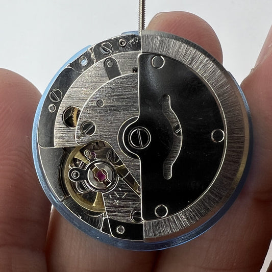 Tian Jing DG2813 automatic watch with silver dial, mechanical movement, day-date display, elegant design.