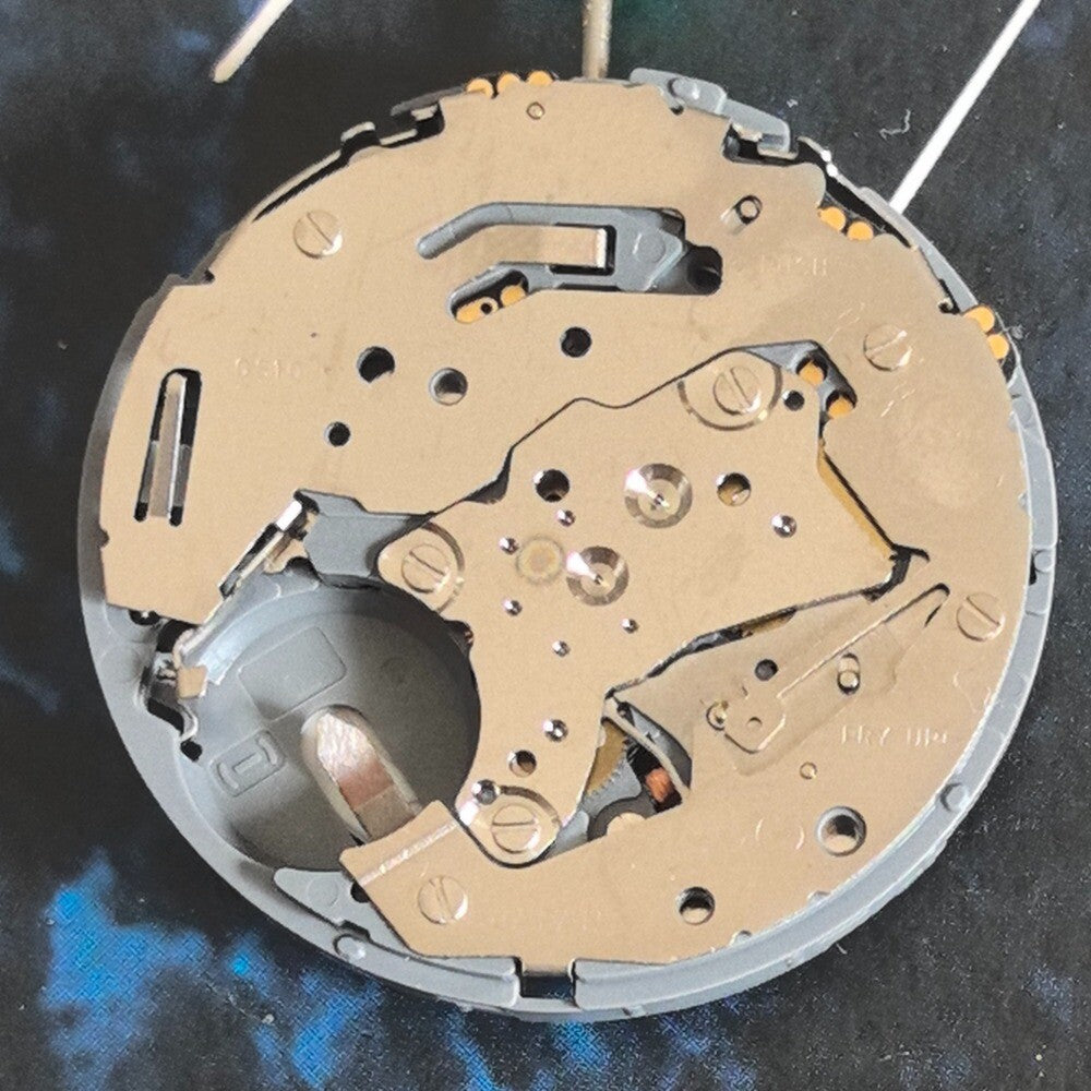 Miyota OS10 quartz watch movement with multifunctional 3 eyes and single calendar display at 3 o'clock.