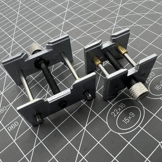 1. Metal watch movement holder clamp set for precise repair.