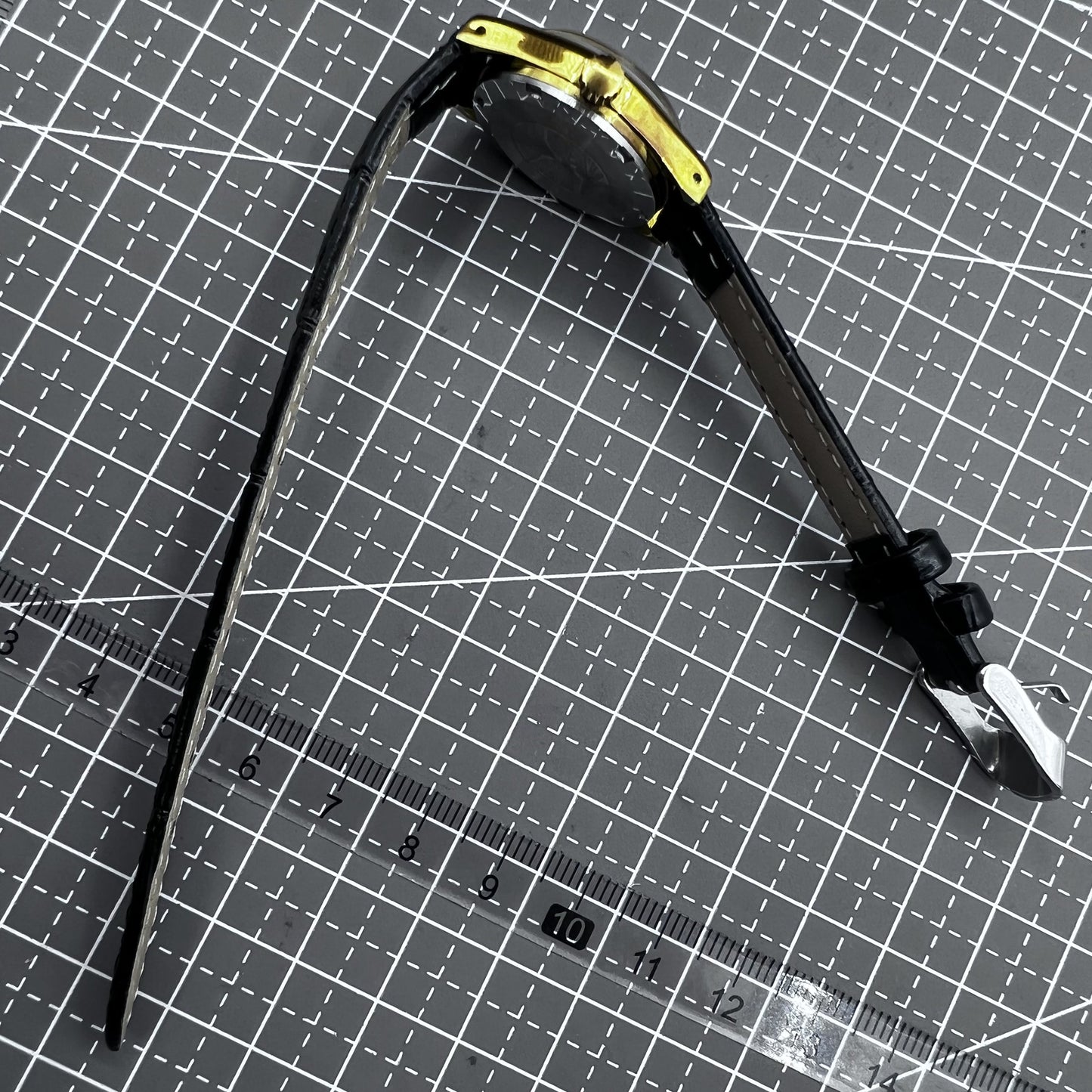 Black round case ladies watch with golden hour markers, Tianjin Seagull manual movement, elegant accessory.