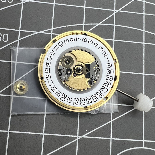 ETA 955.412 quartz watch movement with 3 hands and date display at 3 o'clock for precise timekeeping.