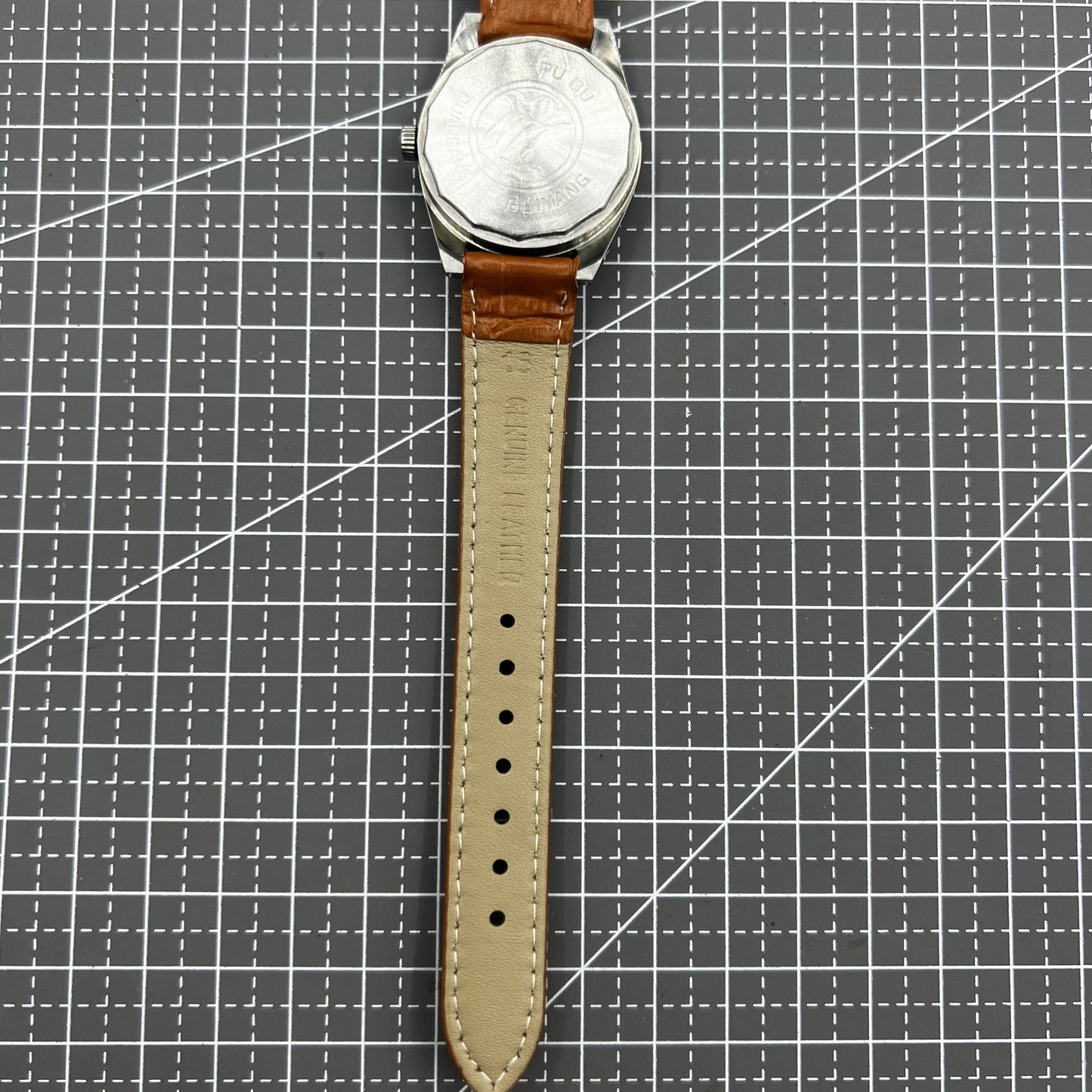 PUBU 32mm grey dial manual watch with 17 jewels, elegant nail indices, showcasing Chinese craftsmanship.