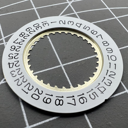 White date disk wheel for Ronda 5040D and 5030D watch movements, date at 4 o'clock position.