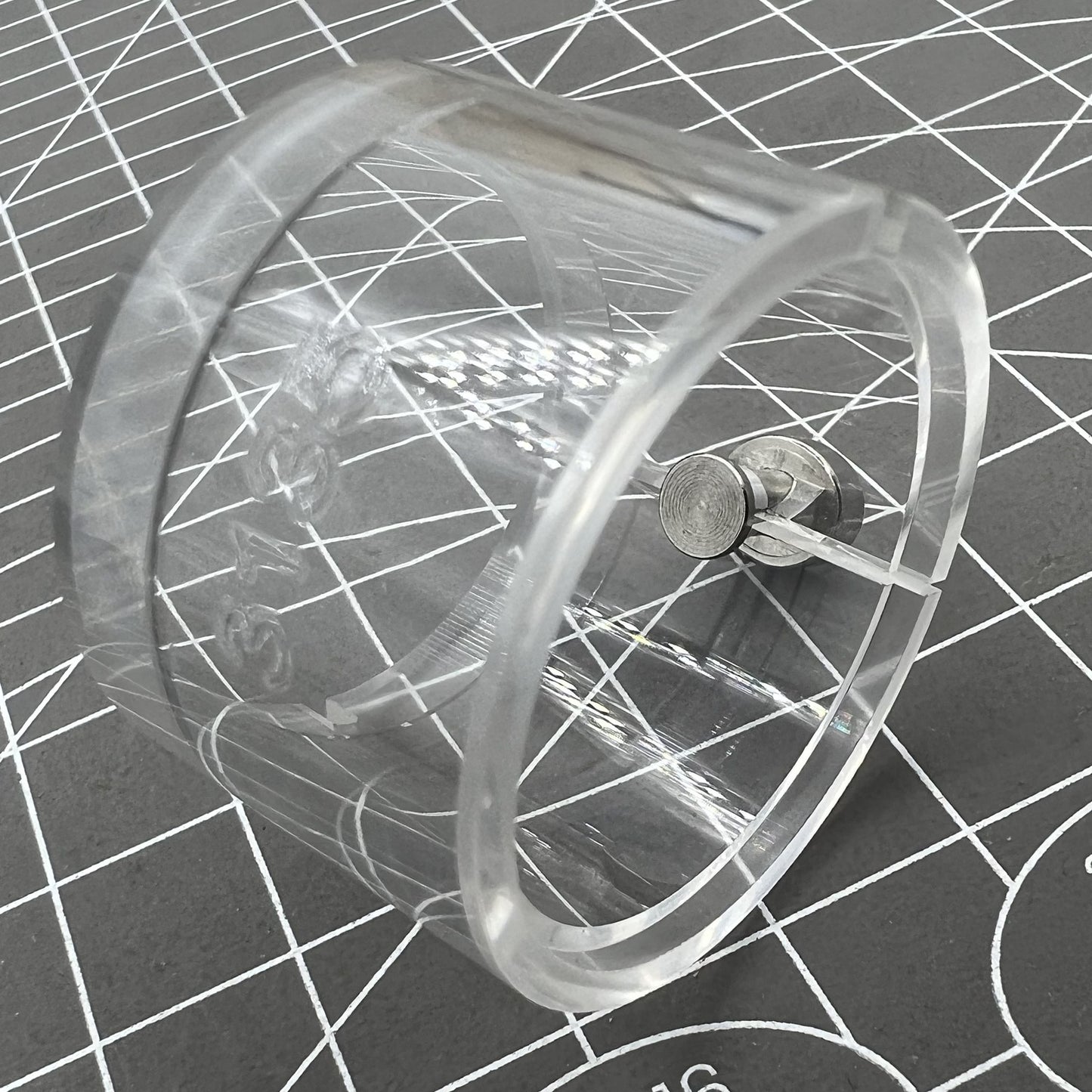 Transparent watch movement holder for RLX3135, secure and precise accessory.
