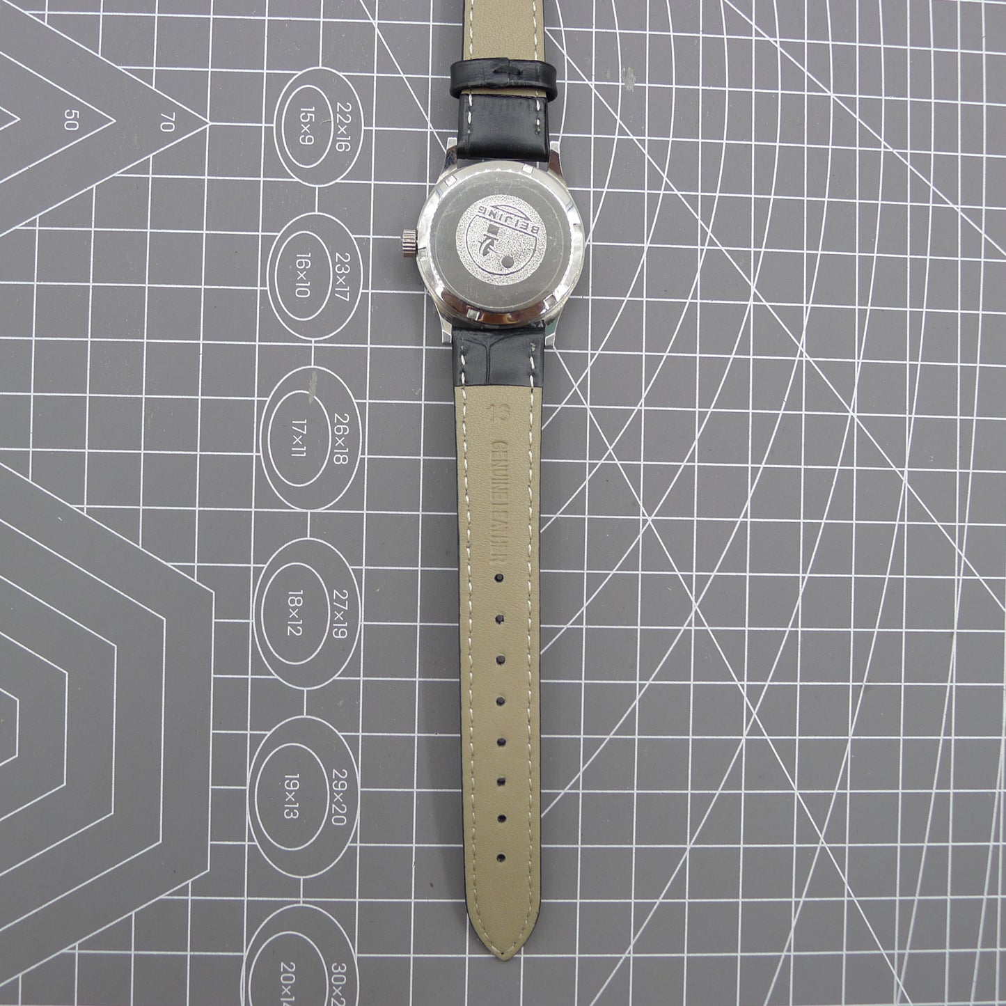 Beijing 31mm manual mechanical watch with silver case, double rhomb dial, showcasing classic Chinese craftsmanship.