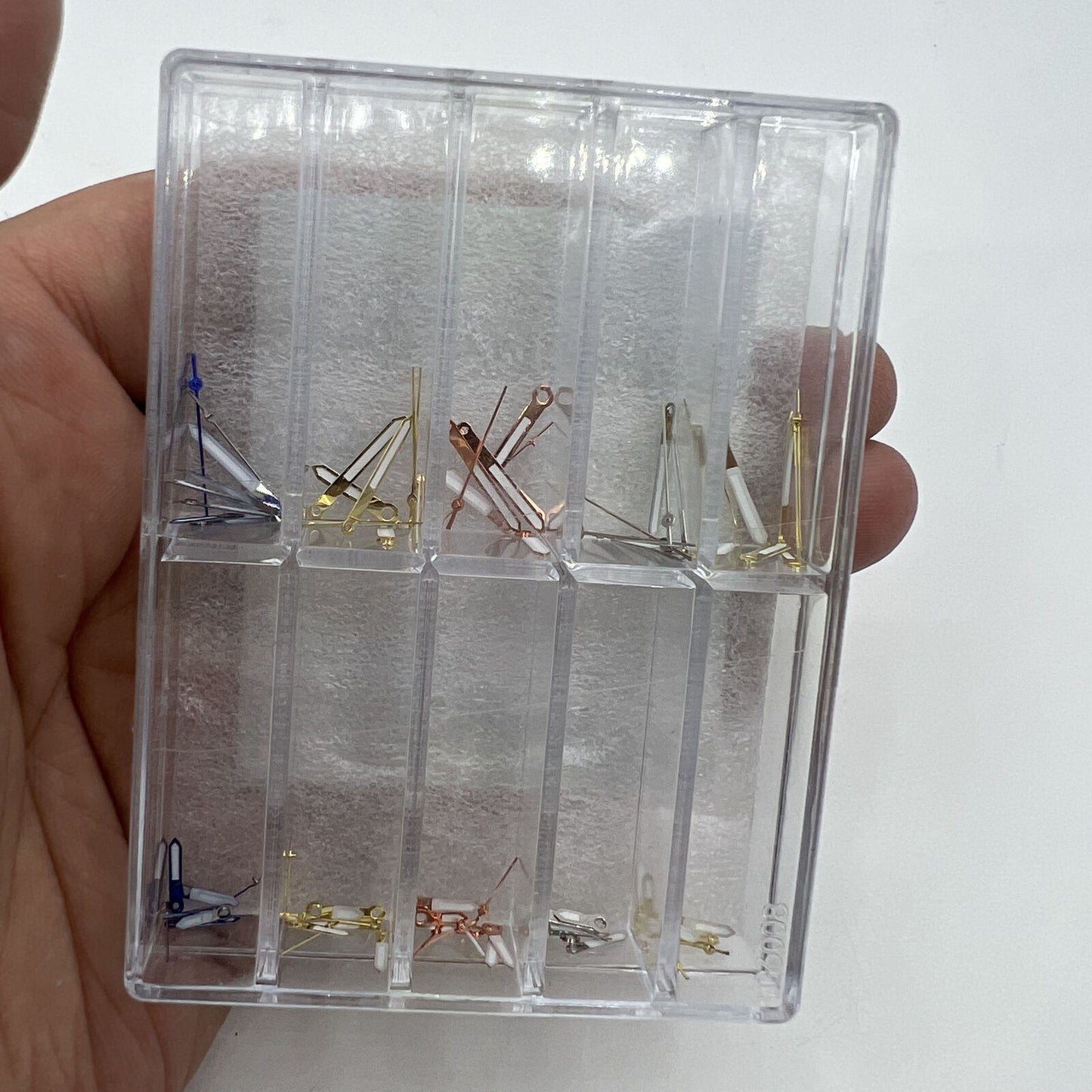 Precision quartz watch hands set for VX series, including small, minute, and hour hands.