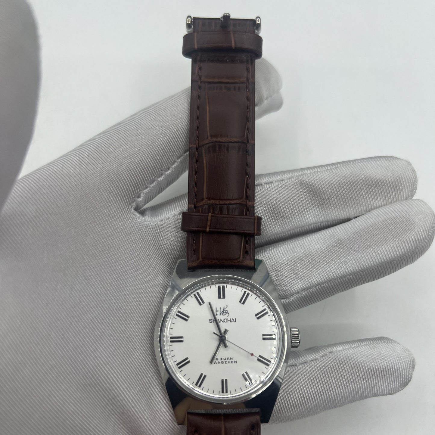 Shanghai Factory 38mm manual mechanical watch with white dial, 3 hands, 19 jewels for accurate timekeeping.