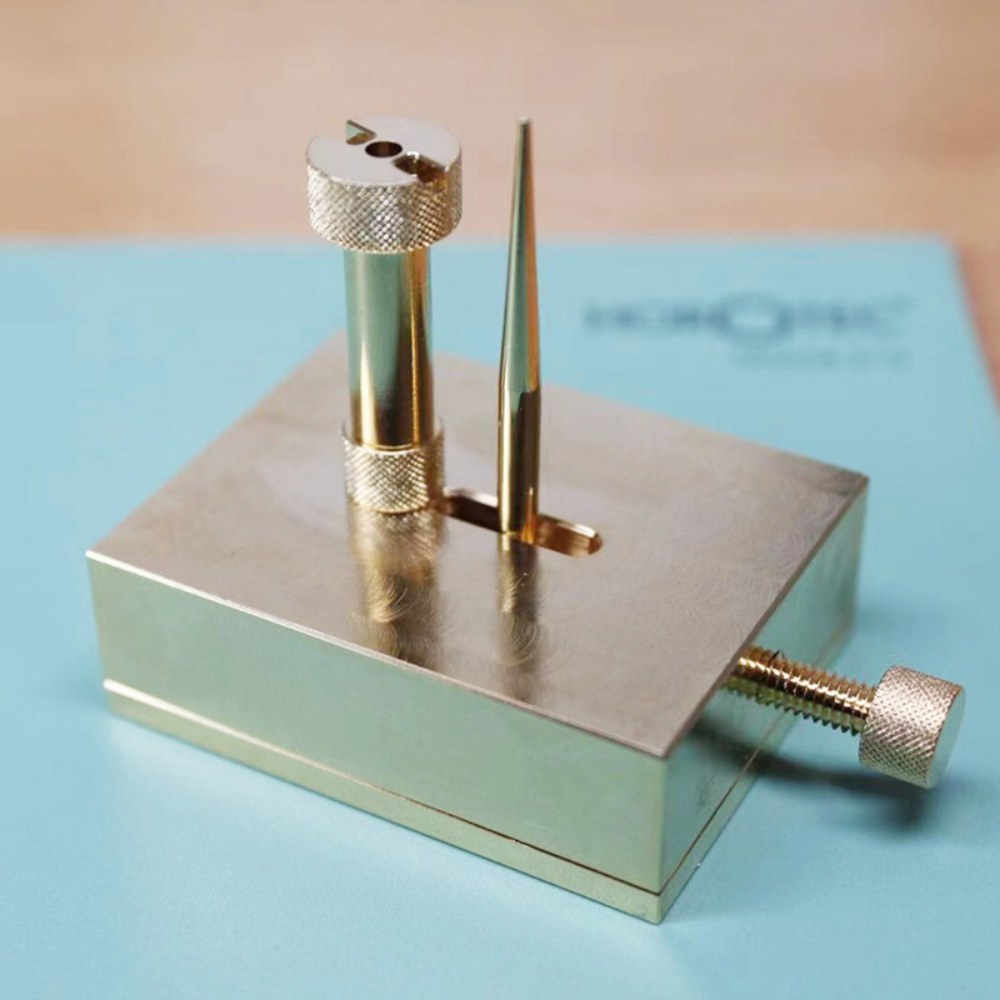 Brass adjustable balance-cock support tool for precise watch movement repairs with dust cover