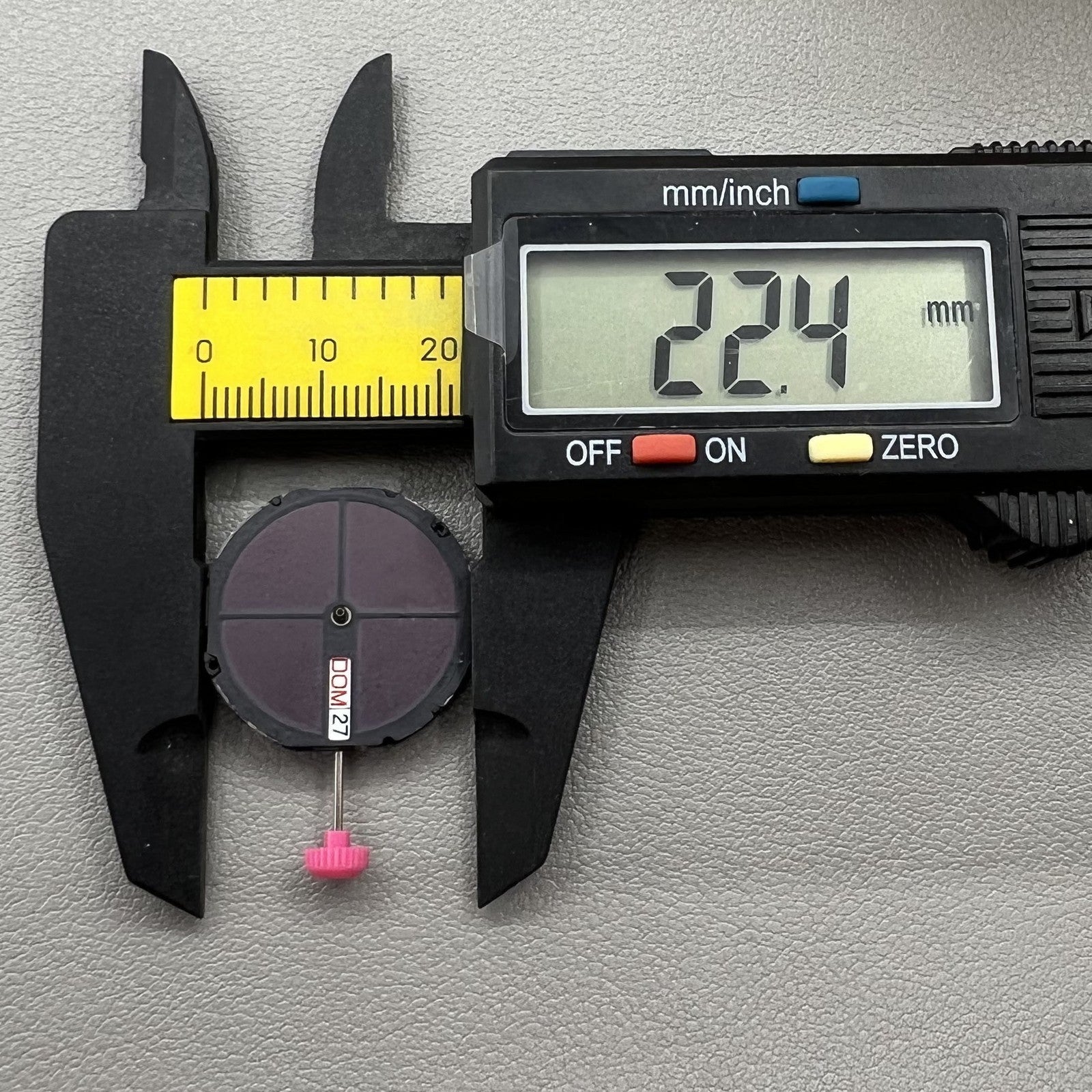 Citizen Eco-Drive E100 solar watch with quartz movement, day-date display, and silver stainless steel case.