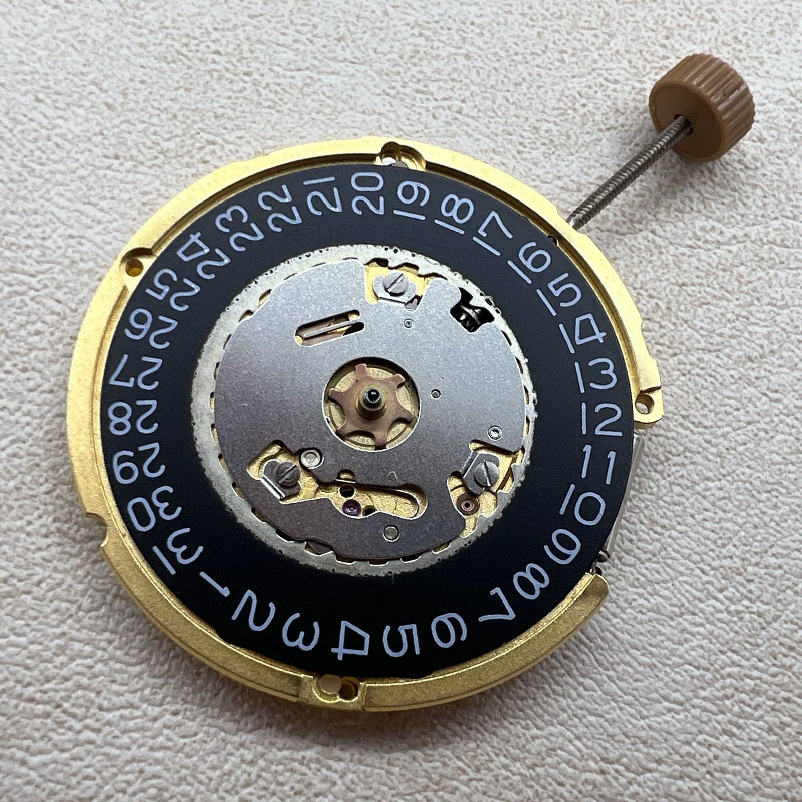 Swiss Ronda 6003.D quartz watch movement featuring 3 hands and single calendar on black dial by Swiss brand.