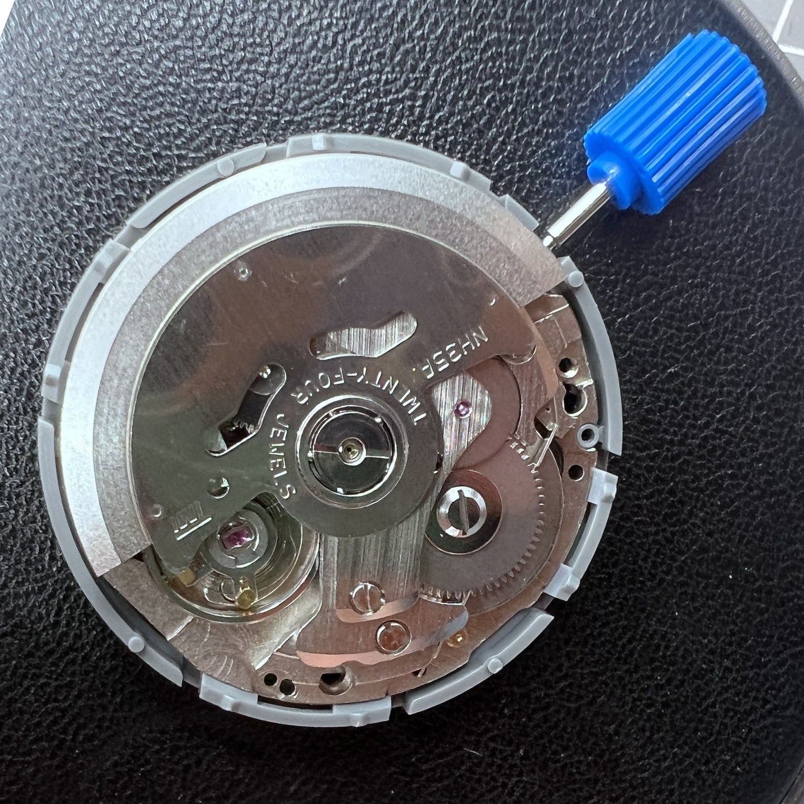 Seiko NH35 automatic watch movement with white dial, reliable precision for watch repairs and upgrades.