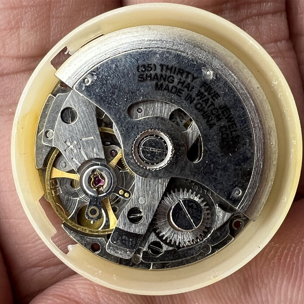 Shanghai 8120 mechanical watch movement showcasing detailed gears for disassembly practice by China brand.