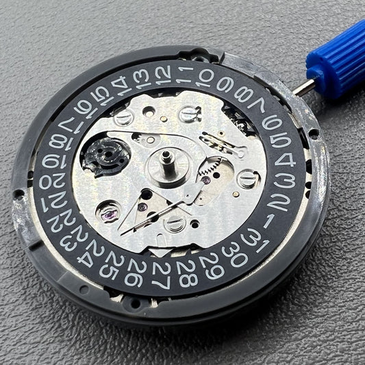 Seiko NH35 watch with black date dial and crown at 3:00, automatic mechanical movement.