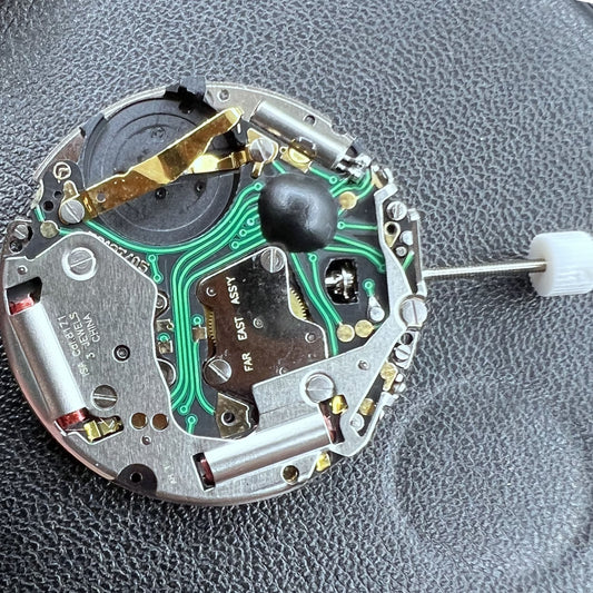 Swiss ISA 8171A quartz watch movement with black dial, four hands, and date at 6 o'clock for precise timekeeping.