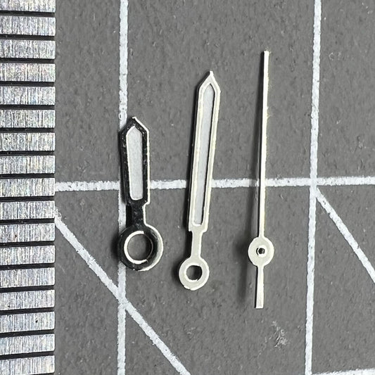 9.5mm white-trimmed green lume watch hands by Miyota for 1L12 Japan quartz movement precision.