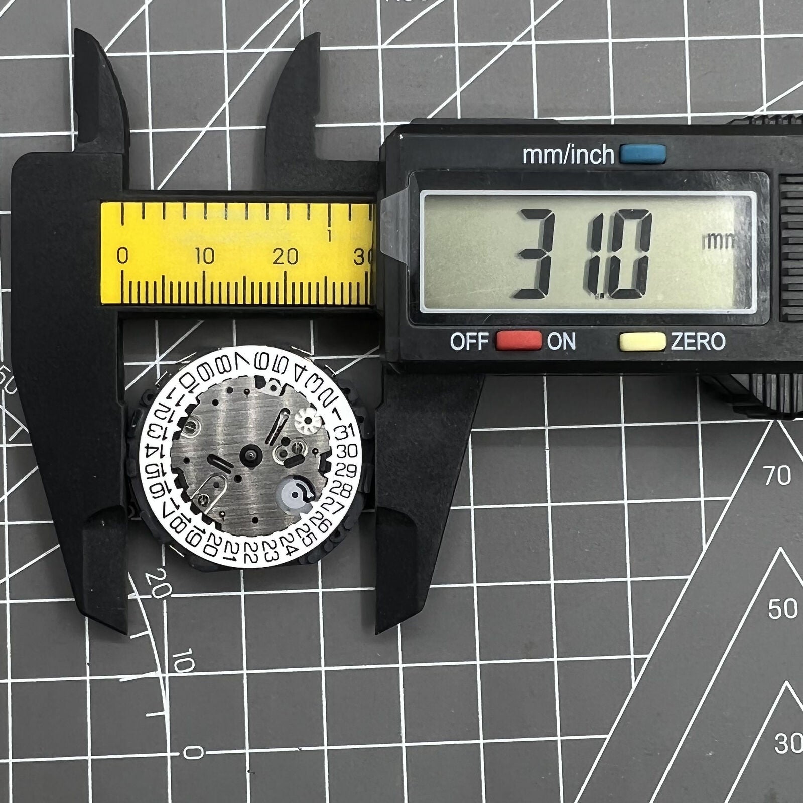 Hattori Epson TMI Japan VR3G quartz watch movement, precise timekeeping component for watch repairs.