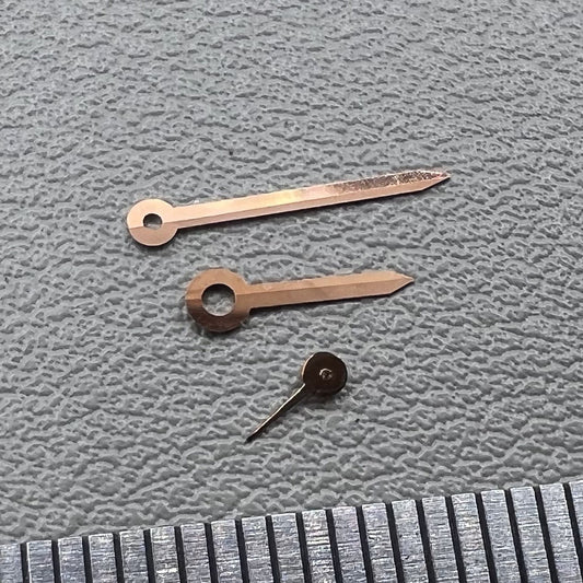 Set of rose gold arrow-shaped watch hands for Miyota 1L45 movement, stylish trim.