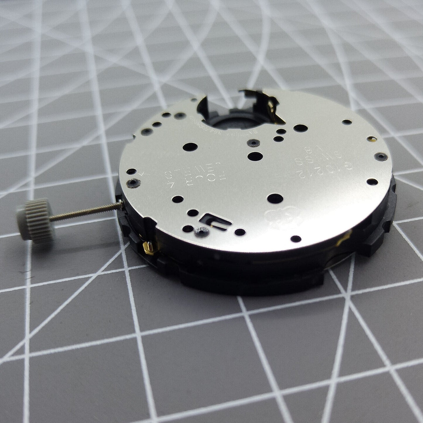 Swiss Made ETA G10.212 quartz watch movement with date and 3 hands, precision accessory for repairs.